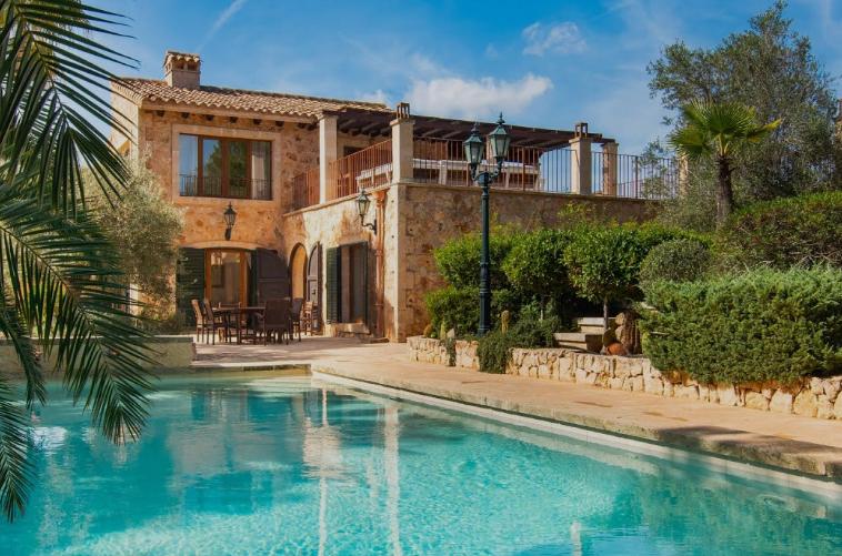 Traditional Mallorcan stone villa with pool and palms